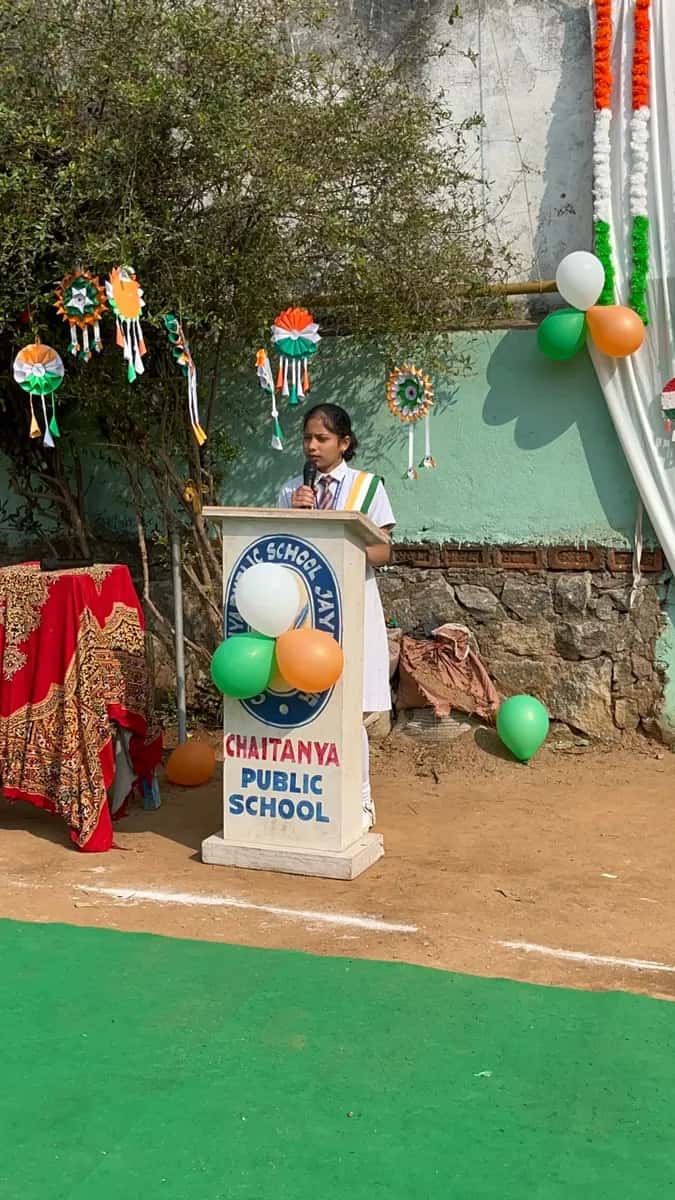 Student addressing the gathering on a national day