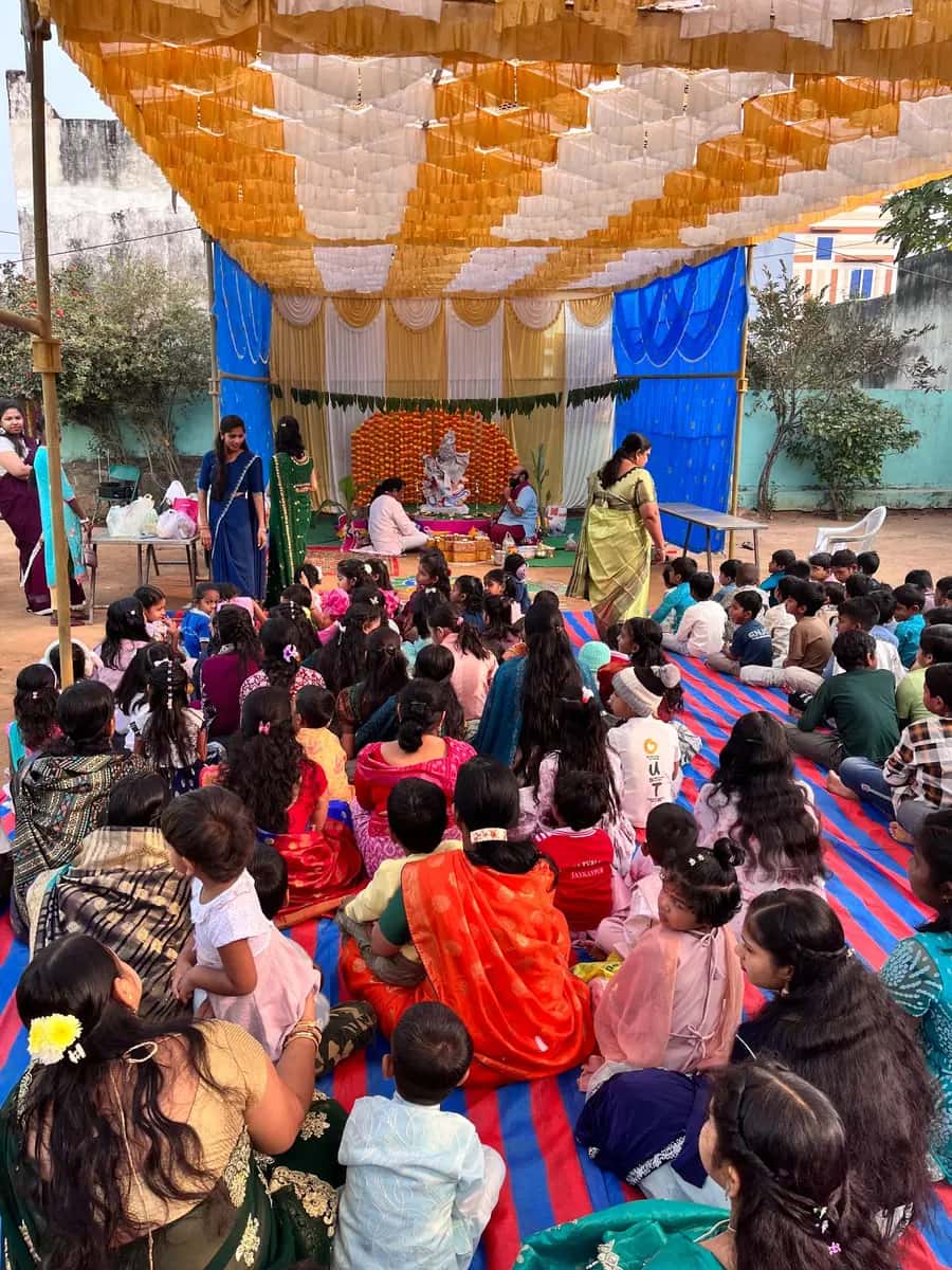 Puja ceremony with students and parents