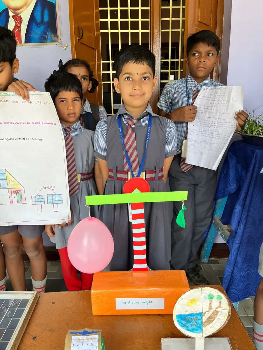 Students presenting a science exhibition model